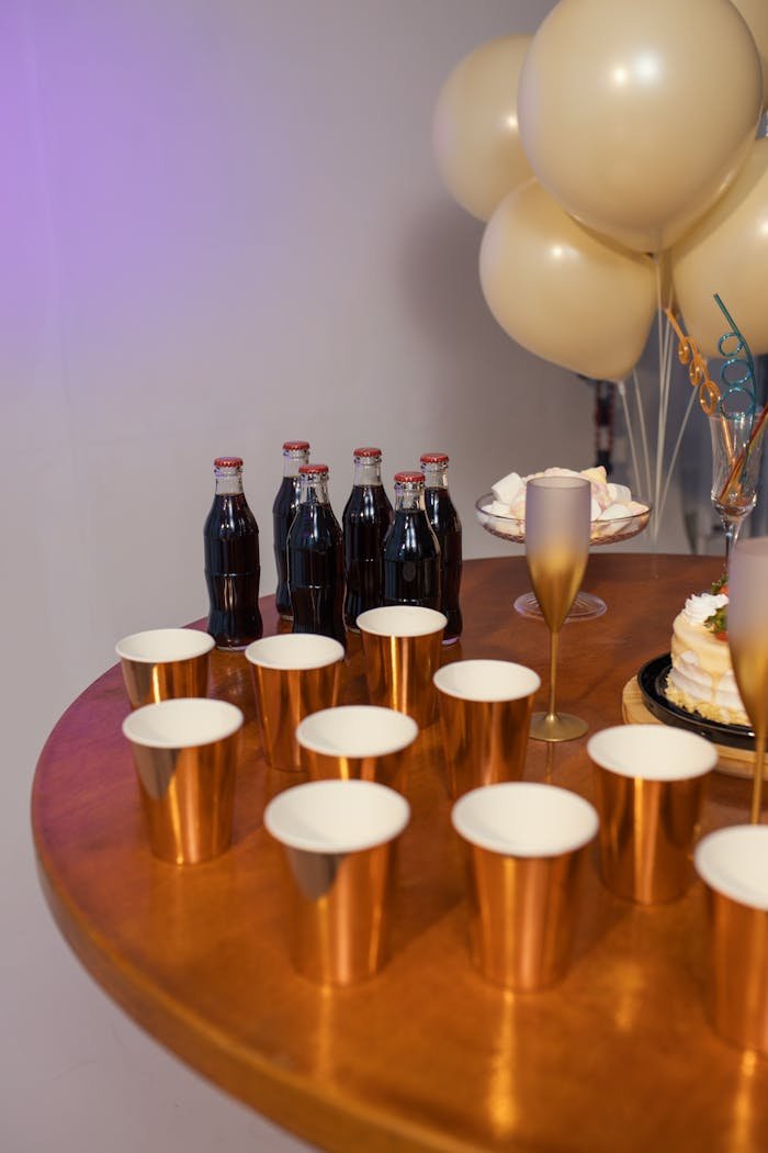 Festive table with drinks and cake, capturing a vibrant Brazilian birthday celebration.